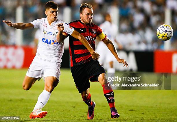 Vitor Bueno of Santos and Willian Farias of Vitoria in action during the match between Santos and Vitoria for the Brazilian Series A 2016 at Vila...