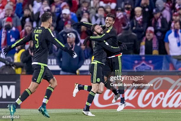 Mexico Men's National Team player Miguel Layun celebrates with Mexico Men's National Team player Carlos Vela and teammates after scoring a goal past...