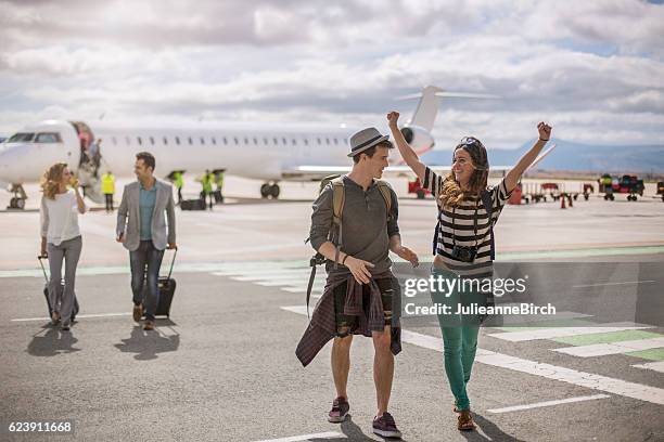 happy to be on holiday - airport hipster travel stockfoto's en -beelden