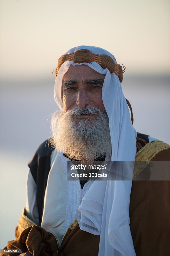 Happiness old Arabic man with traditional clothes