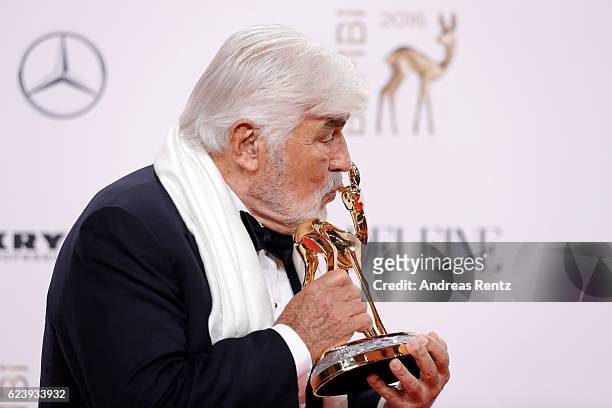 Mario Adorf poses with award at the Bambi Awards 2016 winners board at Stage Theater on November 17, 2016 in Berlin, Germany.