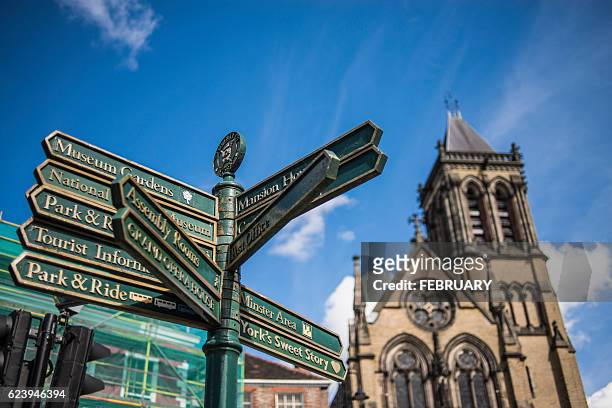 signage pole in front of big church at york, united kingdom - princess beatrice of york stockfoto's en -beelden
