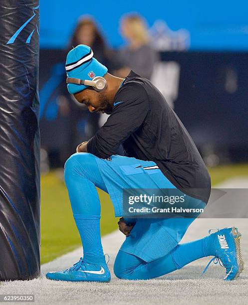 Joe Webb of the Carolina Panthers kneels at the goal post before their game against the New Orleans Saints at Bank of America Stadium on November 17,...