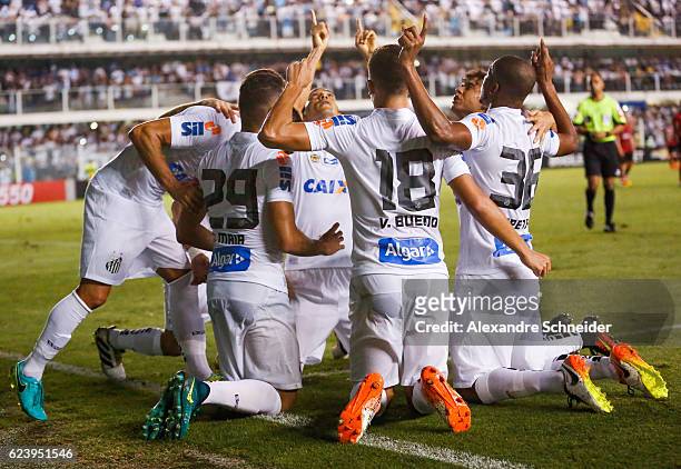 Ricardo Oliveira of Santos celebrates their second goal with his team mates during the match between Santos and Vitoria for the Brazilian Series A...