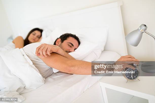 just another five minutes... - closed off body language stock pictures, royalty-free photos & images