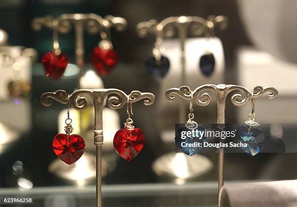 earings displayed in a store display case - silver spoon in mouth stock pictures, royalty-free photos & images