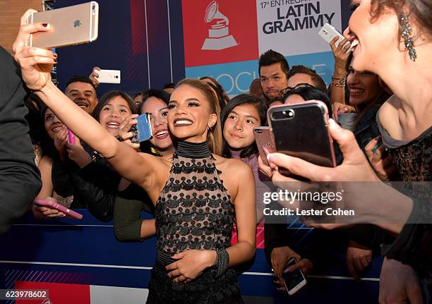 Singer Leslie Grace takes a selfie with fans at The 17th Annual Latin Grammy Awards at T-Mobile Arena on November 17, 2016 in Las Vegas, Nevada.