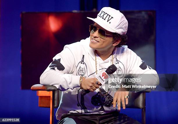 Bruno Mars speaks with host JoJo onstage at iHeartRadio Theater on November 17, 2016 in Burbank, California.