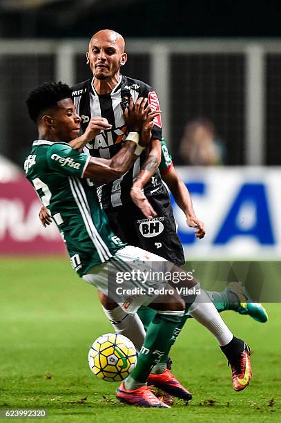 Fabio Santos of Atletico MG and Tche Tche of Palmeiras battle for the ball during a match between Atletico MG and Palmeiras as part of Brasileirao...