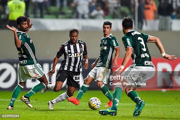 Carlos Cesar of Atletico MG and Santos of Palmeiras battle for the ball during a match between Atletico MG and Palmeiras as part of Brasileirao...