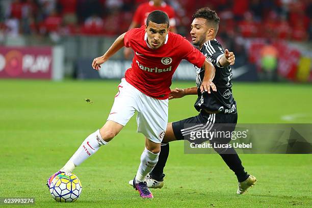 Willian of Internacional battles for the ball against Clayson of Ponte Preta during the match between Internacional and Ponte Preta as part of...