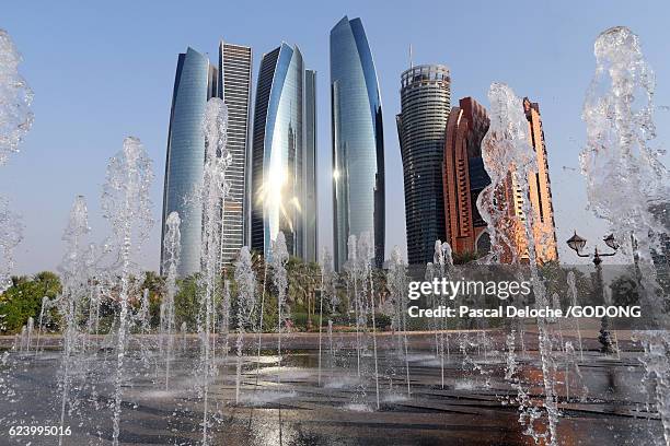 abu dhabi, the etihad towers building complex - batiment stock pictures, royalty-free photos & images