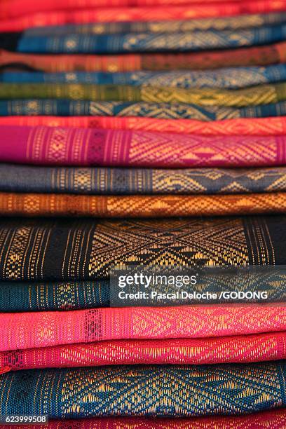 colorful laotian silk sarongs at market - colore stock pictures, royalty-free photos & images