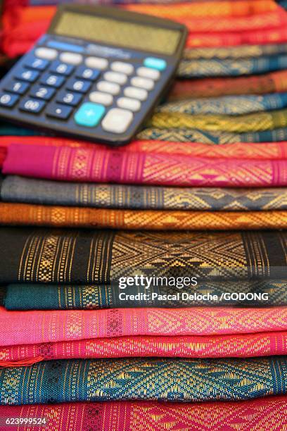 colorful laotian silk sarongs at market - colore stock pictures, royalty-free photos & images