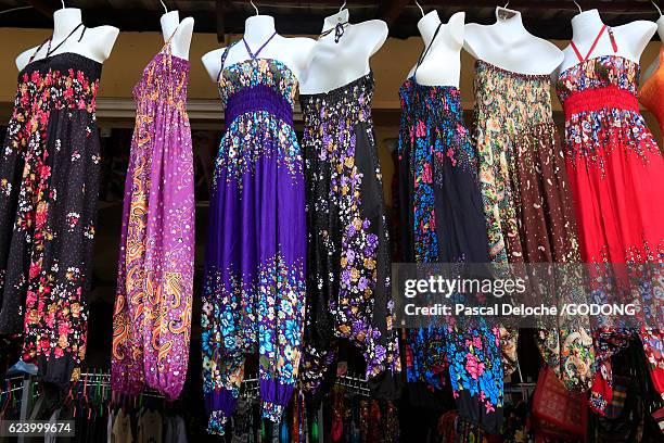 colored dresses at market - colore stock pictures, royalty-free photos & images