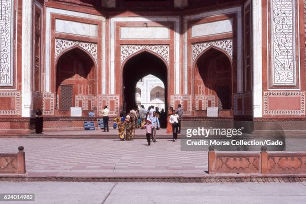 View of tourists walking outside the entrance to the Jama Masjid Mosque, in the city of Fatehpur Sikri, in the Agra district of Uttar Pradesh, India,...