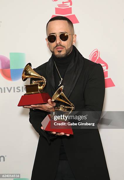 Recording artist Yandel poses with Best Urban Fusion/Performance and Best Urban Song awards in the press room during The 17th Annual Latin Grammy...