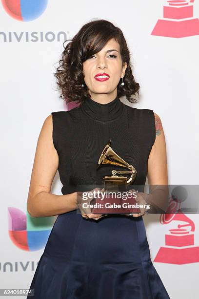 Recording artist Ceu poses with Best Portuguese Language Contemporary Pop Album award in the press room during The 17th Annual Latin Grammy Awards at...