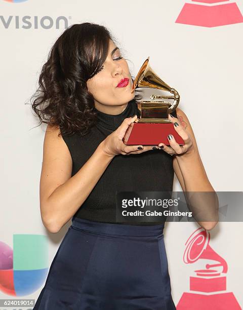 Recording artist Ceu poses with Best Portuguese Language Contemporary Pop Album award in the press room during The 17th Annual Latin Grammy Awards at...