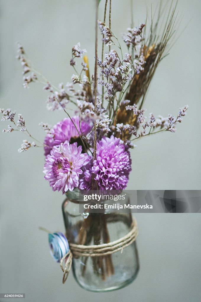 Purple flowers in jar