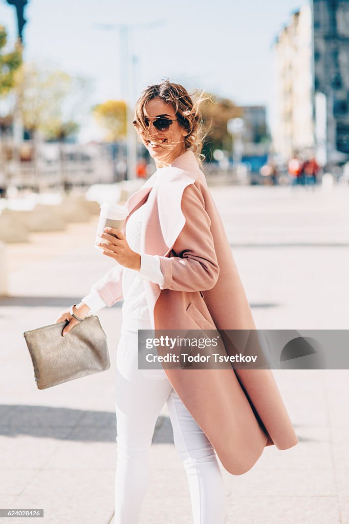 Beautiful elegant woman drinking coffee