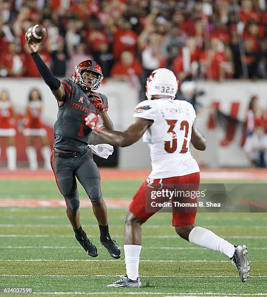 Quarterback Greg Ward Jr. #1 of the Houston Cougars passes against linebacker Stacy Thomas of the Louisville Cardinals in the first quarter at TDECU...