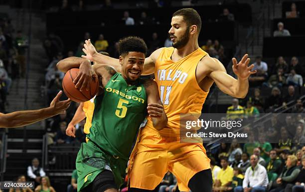 Tyler Dorsey of the Oregon Ducksdrives to the basket on Shane Hammink of the Valparaiso Crusadersin the first half of the game at Matthew Knight...