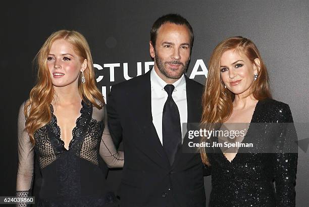 Actress Ellie Bamber, director Tom Ford and actress Isla Fisher attend the "Nocturnal Animals" New York premiere at The Paris Theatre on November 17,...