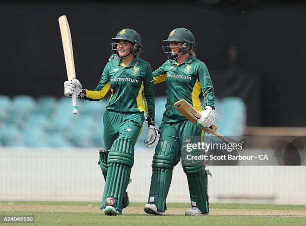 Sune Luus of South Africa is congratulated by Mignon du Preez of South Africa after reaching her fifty during the women's one day international match...