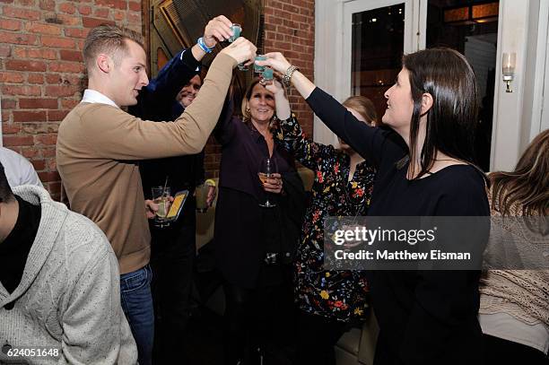 Director Lara Stolman , swimmer Tom Luchsinger and guests toast at the afterparty for the New York premiere of "Swim Team" at DOC NYC on November 17,...