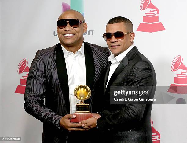 Recording artist Alexander Delgado and Randy Martinez of Gente De Zona pose with the Best Tropical Fusion Album award in the press room during The...