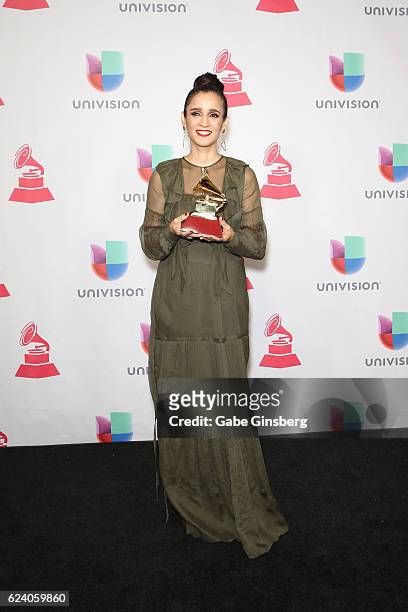 Recording artist Julieta Venegas poses with the Best Pop/Rock Album award in the press room during The 17th Annual Latin Grammy Awards at T-Mobile...