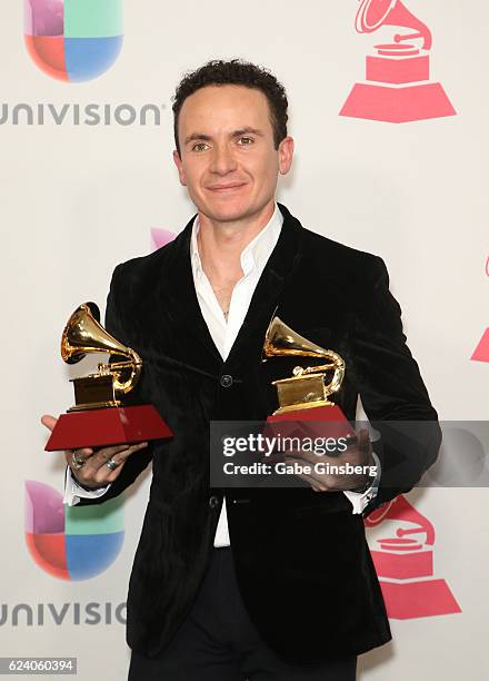 Recording artist Fonseca poses with the Best Cumbia/Vallenato Album and Best Tropical Song awards in the press room during The 17th Annual Latin...