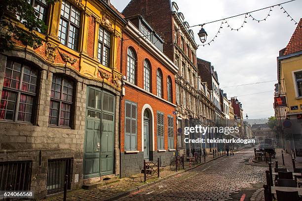 traditional old buildings by street at lille france - lille cafe stock pictures, royalty-free photos & images