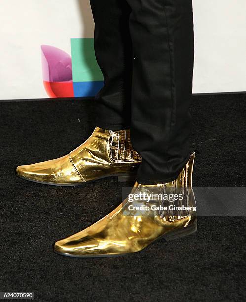 Motif, shoe detail, poses in the press room during The 17th Annual Latin Grammy Awards at T-Mobile Arena on November 17, 2016 in Las Vegas, Nevada.