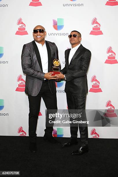 Recording artist Alexander Delgado and Randy Martinez of Gente De Zona pose with the Best Tropical Fusion Album award in the press room during The...