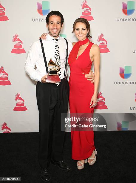 Director Hernan Corera and actress Sandra Criolani pose with the Best Short Form Music Video award in the press room during The 17th Annual Latin...