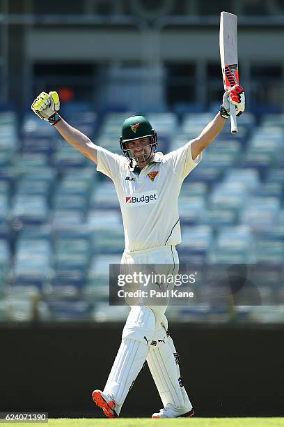 Alex Doolan of Tasmania celebrates after making his century during day two of the Sheffield Shield match between Western Australia and Tasmania at...