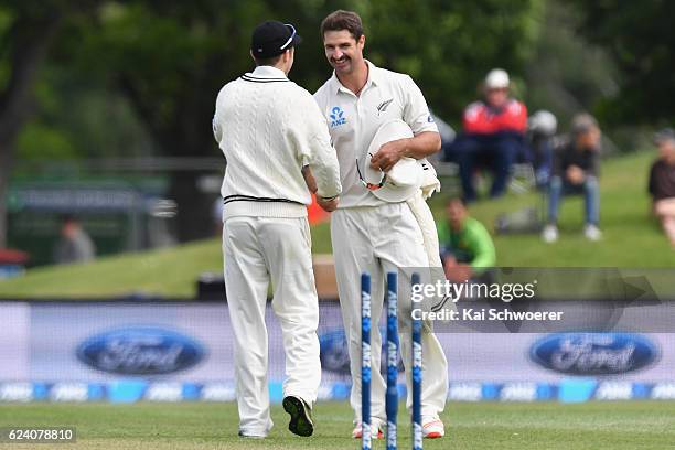 Colin de Grandhomme of New Zealand is congratulated by Todd Astle of New Zealand after claiming his 6th wicket during day two of the First Test...