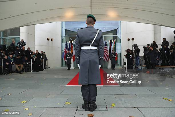 Honour guard soldiers establish themselves at the red carpet prior to the arrival of U.S. President Barack Obama and western European leaders at the...
