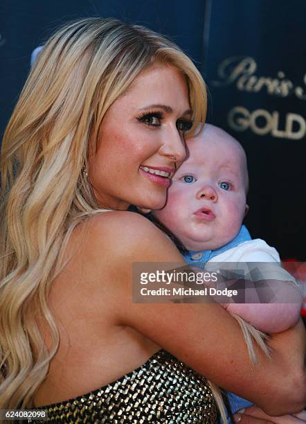 Paris Hilton poses with fans baby during a Q&A with fans at Westfield Doncaster on November 18, 2016 in Melbourne, Australia.