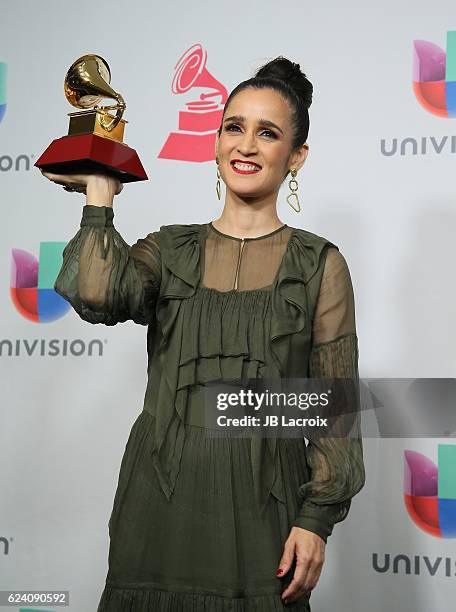 Recording artist Julieta Venegas poses with the Best Pop/Rock Album award in the press room during The 17th Annual Latin Grammy Awards at T-Mobile...