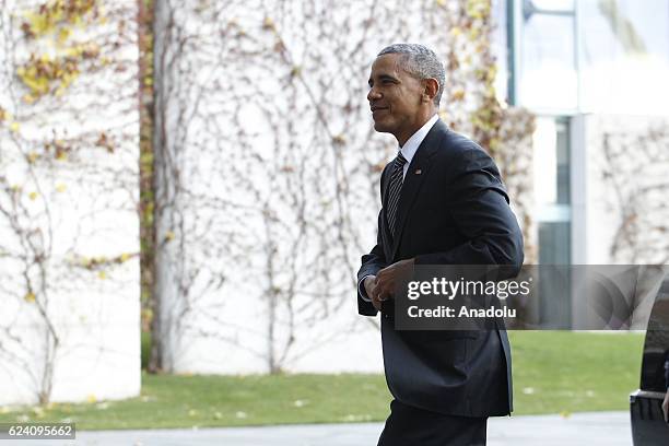 President Barack Obama gestures as German Chancellor Angela Merkel welcomes him prior to the meeting with EU leaders and the US President Barack...
