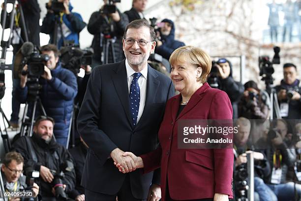 German Chancellor Angela Merkel welcomes Spanish Prime Minister Mariano Rajoy prior to the meeting with EU leaders and the US President Barack Obama...
