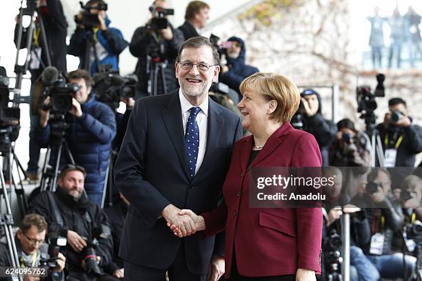 German Chancellor Angela Merkel welcomes Spanish Prime Minister Mariano Rajoy prior to the meeting with EU leaders and the US President Barack Obama...