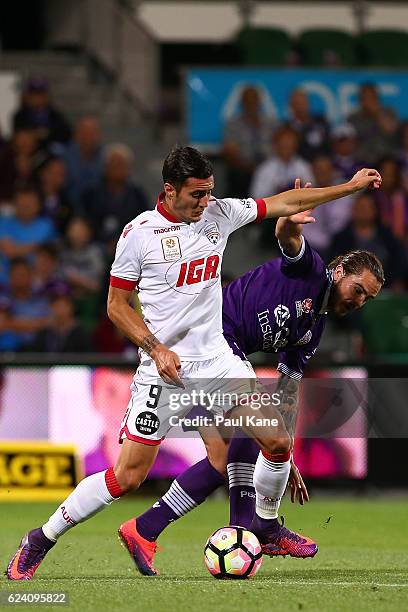 Sergi Guardiola of Adelaide and Josh Risdon of the Glory contest for the ball during the round seven A-League match between the Perth Glory and...