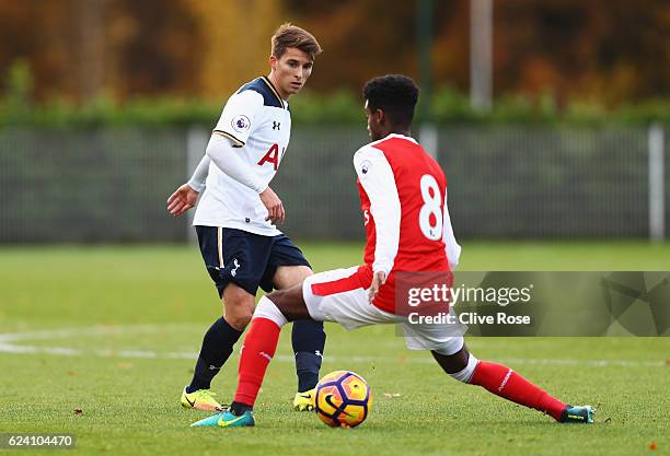 Tom Carroll of Tottenham Hotspur is closed down by Gedion Zelalem of Arsenal during the Premier League 2 match between Tottenham Hotspur and Arsenal...