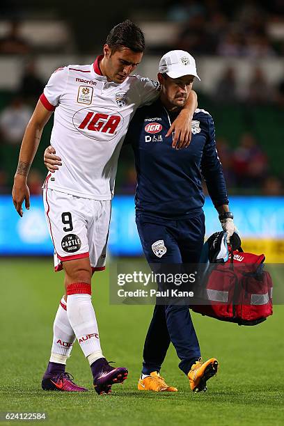 Sergi Guardiola of Adelaide is assisted from the field during the round seven A-League match between the Perth Glory and Adelaide United at nib...
