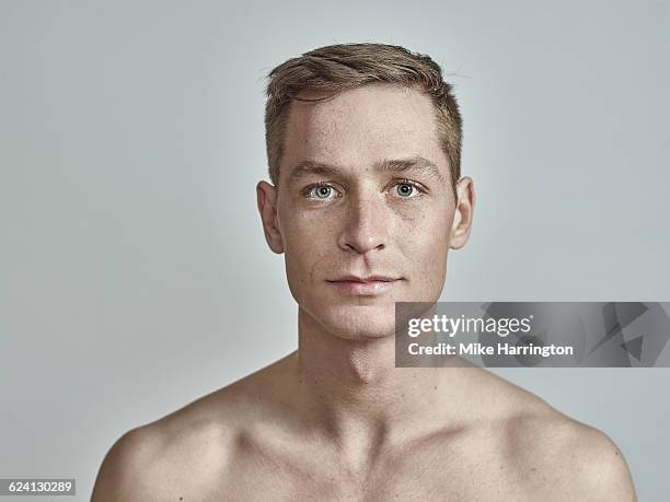 young european male with freckles - soft smile portrait stock pictures, royalty-free photos & images
