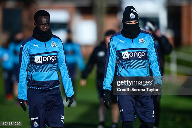 Cheick Tiote and Aleksandar Mitrovic walk outside during Newcastle United Training Session at The Newcastle United Training Centre on November 18,...